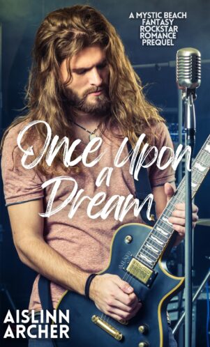 Book cover for 'Once Upon a Dream' Mystic Beach Fantasy Rockstar Romance novel by Aislinn Archer, featuring long-haried man playing electirc guitar next to a microphone